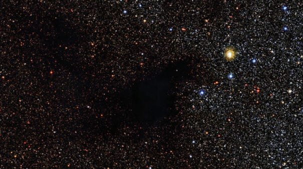 Astronomers photographed a giant cosmic cloud obscuring the stars