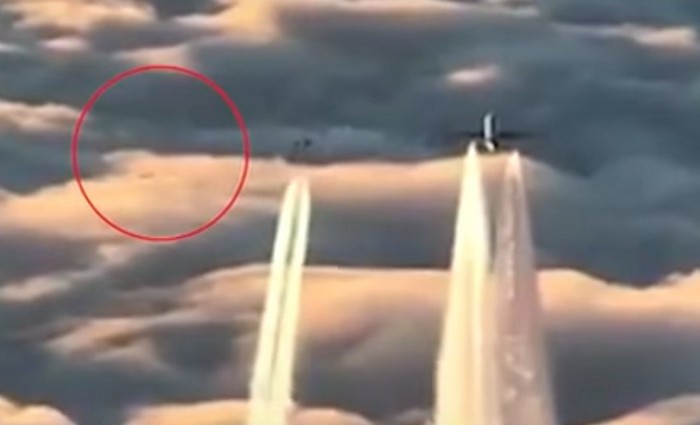 Airliner escorted by fighters and UFOs