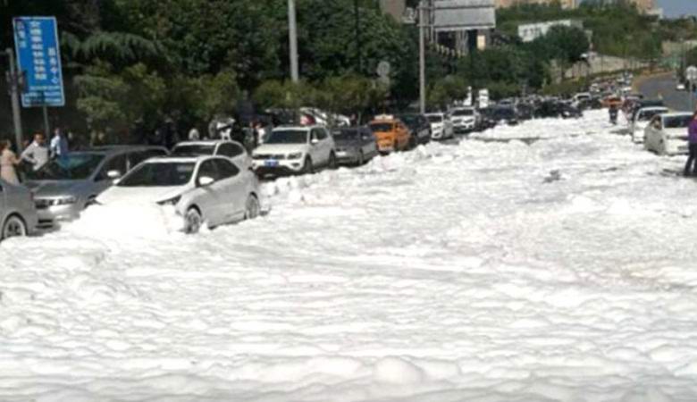 Snow-white foam covered a street in a Chinese city