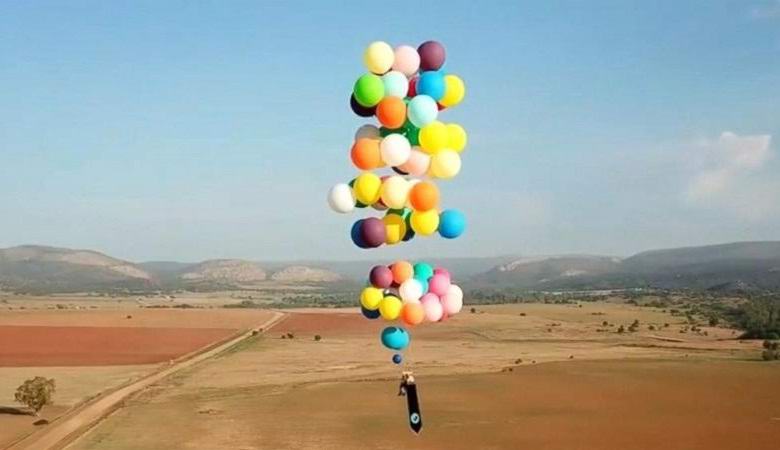 The Briton flew into the sky in a hundred balloons