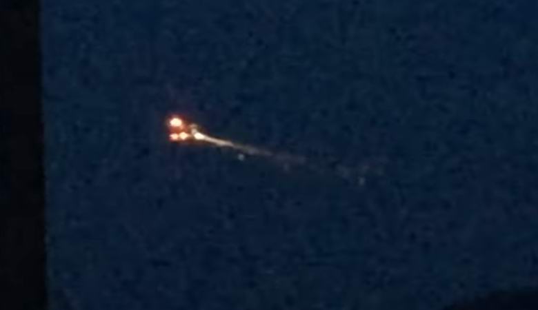 A burning UFO captured in the night sky