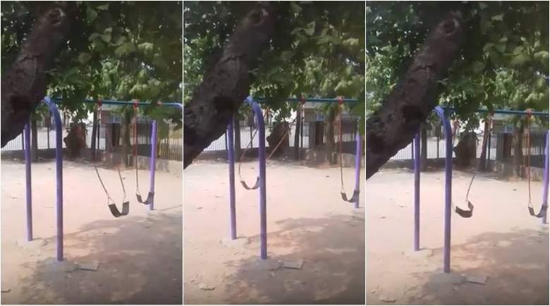 A swing swinging on their own in a mysterious video