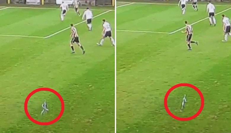A tiny little man ran across a field during a football match