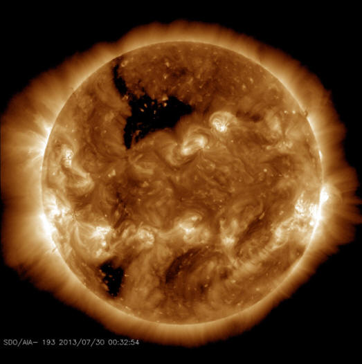 A small hole is visible on the side of the Sun facing the Earth.