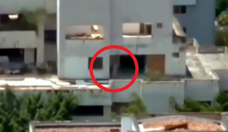 A ghostly figure flashed in the building just before it was torn down.