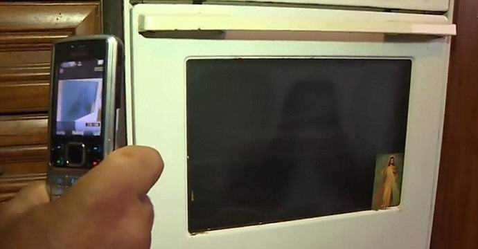 Slovak gypsies pray in the kitchen stove