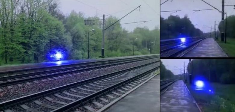A strange blue luminous ball flies over the railway, and then explodes.