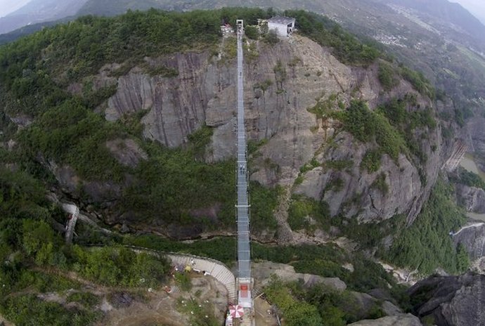 Transparent bridges are stamped for tourists in China