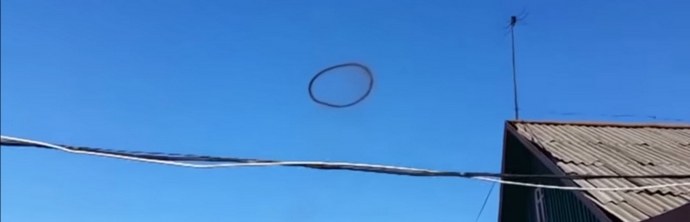 A black circle hangs in the sky of Kazakhstan