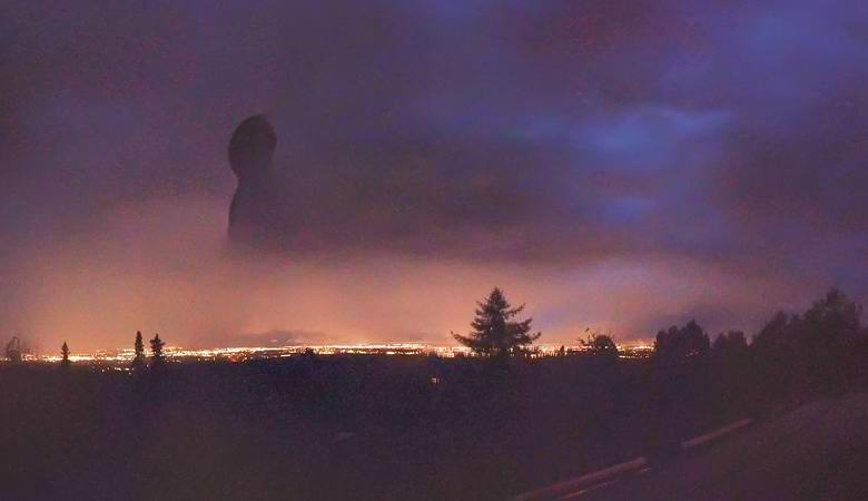 A mysterious giant silhouette photographed over night Alaska