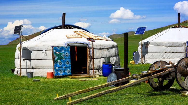Residents of Mongolia surround their lonely yurts in the middle of the bare steppe with a high fence and tires.