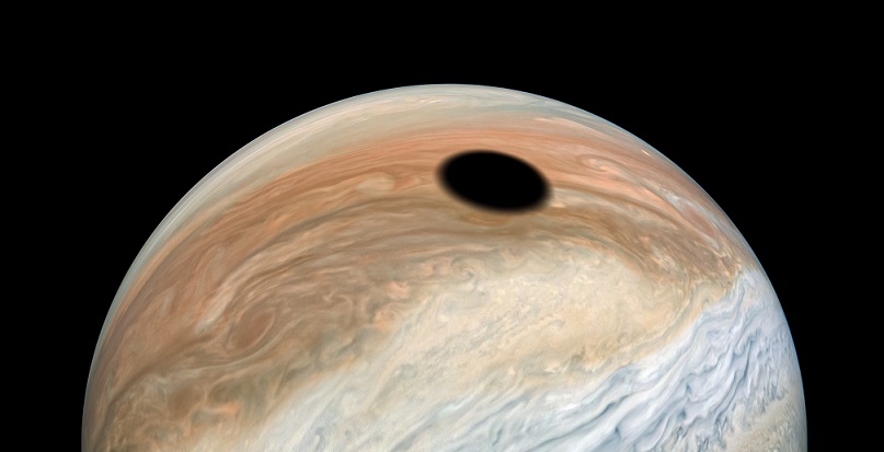 The probe captured the shadow of Io cast on the surface of Jupiter